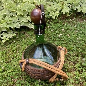 Vintage glass wine decanter with wooden & brass stopper wrapped by leather